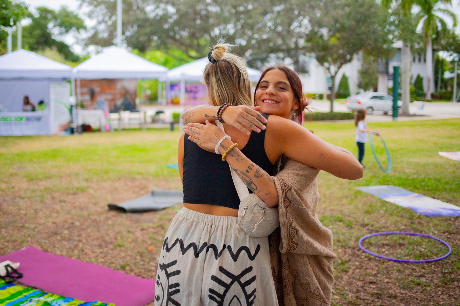 Two people embracing at a Coco gathering